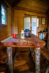 a wooden table with a tea kettle on top of it at Cabane perchée in Puylaurens