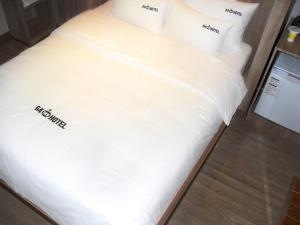 Katil atau katil-katil dalam bilik di 64 Inn Hotel