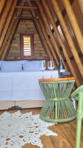 a room with a table and two wine glasses at Cabana Redonda Beach in Icapuí +23 photos