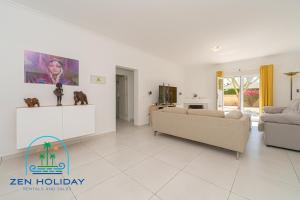 a living room with two couches and a tv at Villa Reyets 4 bed 3 bath Private Pool in Busot +28 photos