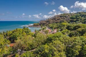 an aerial view of the ocean and a resort at Casita Gitza in Montezuma
