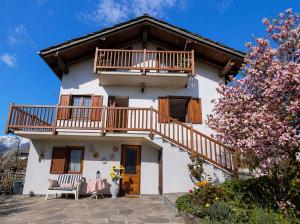 a house with a balcony and a staircase on it at VILLA ADRY Aosta Sarre Your freedom in Aosta