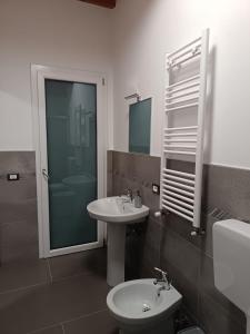 a bathroom with a sink and a toilet and a mirror at B&B Belvedere in Monreale +29 photos