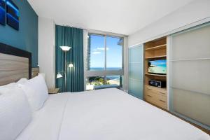 a bedroom with a large bed and a large window at Oceanview Apt Marenas Resort, Direct Beach Access! in Sunny Isles Beach +54 photos