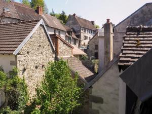 a group of houses and roofs in a town at Chez Philomène in Aubusson