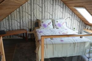 a bed in a room with a wall at De Kopstoof in Lekkerkerk