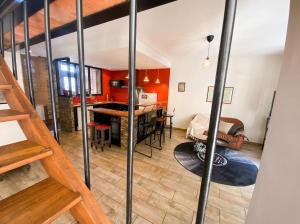 a living room and dining room with a loft at Le loft de l'entrepote in Argenton-sur-Creuse