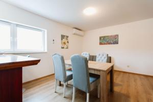 a dining room with a table and chairs at Mia in Livno