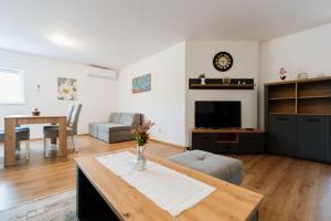 a living room with a couch and a table at Mia in Livno
