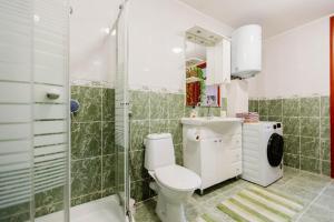 a bathroom with a toilet and a shower at Mia in Livno