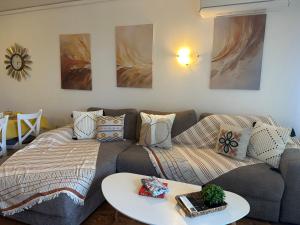 a living room with a couch and a table at Atia Resot in Chernomorets +14 photos