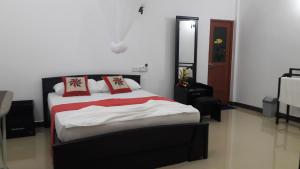 Letto o letti in una camera di Sigiri Regal Residence