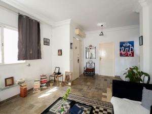 a living room with a couch and a table at Meraki house in La Marsa +10 photos
