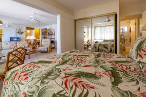 a bedroom with a bed and a living room at Hono Kai Resort B7 in Wailuku +26 photos