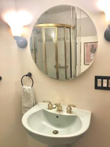 a bathroom with a sink and a mirror at Waterfront Round House View in Oakdale +38 photos