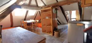 a room with a kitchen and a dining room at Garni Cà Stella in Bignasco