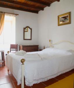 En eller flere senge i et værelse på Quinta do Pinhal