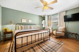 a bedroom with a bed and a ceiling fan at LMI -15- Laurel Falls Room: Summers Night in Lookout Mountain