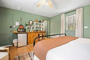 a bedroom with green walls and a bed in it at LMI -15- Laurel Falls Room: Summers Night in Lookout Mountain