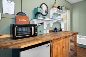a kitchen counter with a microwave on top of it at LMI -15- Laurel Falls Room: Summers Night in Lookout Mountain +21 photos
