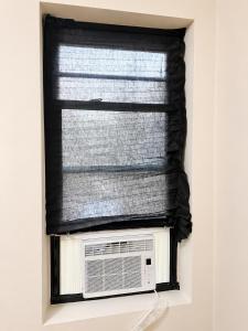 a window in a box with a blind at Anne Room B in Irvington