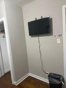 a flat screen tv on the corner of a wall at Anne Room B in Irvington