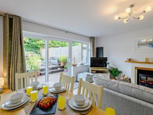a living room with a table and a couch at 3 Bed in Brixham oc-92770 in Brixham