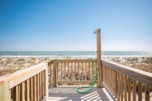 a hose is hooked up to a pole on the beach at Dip Inn by Oak Island Accommodations in Oak Island