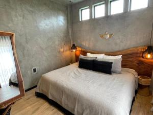 a bedroom with a bed in a room with windows at PH 3-Bedroom Private Pool in TUK in Tulum +18 photos