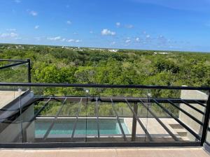 a view from the balcony of a house at PH 3-Bedroom Private Pool in TUK in Tulum