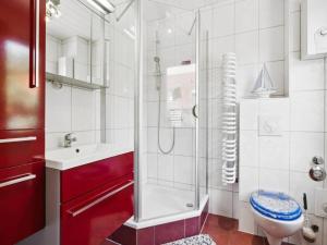 a bathroom with a shower and a toilet and a sink at Delphin in Pruchten
