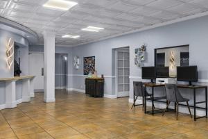a large room with a table and chairs in it at Club Wyndham Sea Gardens in Pompano Beach