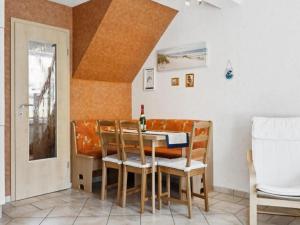 a dining room with a table and some chairs at Delphin in Pruchten