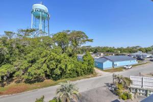 an aerial view of a town with a water tower at Dolphy Daze by Oak Island Accommodations in Oak Island