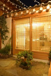 a building with a large window with bars on it at Bukchonae in Seoul