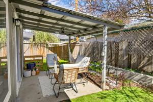 a patio with two chairs and a pergola at Basecamp GP- Private Unit in Quiet Duplex Near Downtown in Grants Pass +33 photos