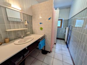 a bathroom with a sink and a shower at Gîte paisible dans ancienne ferme comtoise avec animaux acceptés - FR-1-583-416 in Saint-Bresson +28 photos