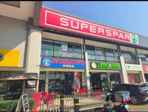 a store with a sign on the front of it at Premium Executive Room in Sandton +10 photos