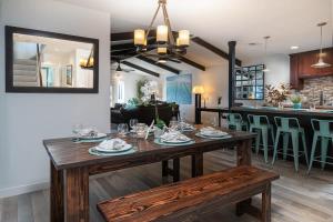 a dining room with a table and a bar at 508 Clubhouse in Newport Beach