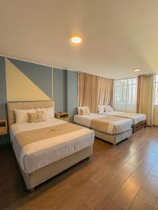 a hotel room with two beds in a room at Andari Hoteles in Arequipa