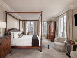 a bedroom with a canopy bed and a chair at Liora Estate in Healdsburg +18 photos