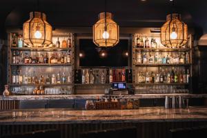 a bar with a lot of bottles of alcohol at Liora Estate in Healdsburg
