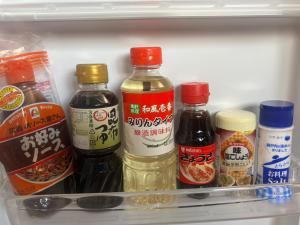 a refrigerator filled with different types of sauce and condiments at Horomisou in Noboribetsu