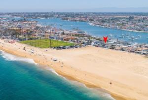 an aerial view of a beach with people on it at 1005 East Balboa in Newport Beach