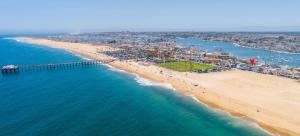 an aerial view of a beach with a pier at 1005 East Balboa in Newport Beach