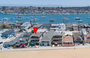 an aerial view of a harbor with houses and boats at 1005 East Balboa in Newport Beach