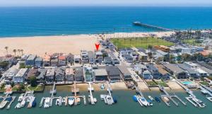 an aerial view of a marina next to the beach at 1005 East Balboa in Newport Beach +34 photos