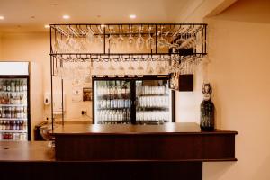 a bar with a bottle of wine glasses at Boonah Valley Motel in Boonah