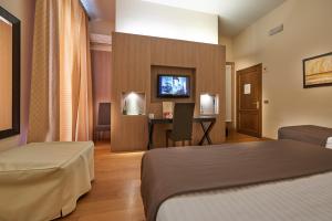 TV a/nebo společenská místnost v ubytování Hotel Cosimo de' Medici