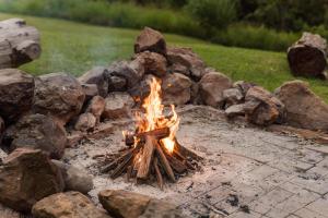 a fire pit with a bunch of rocks at Montville Retreat by Tiny Away in Montville